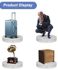 Smooth Operator Heavy Duty Motorized Turntable Remote Controlled Speed Adjustable Rotating Display Platform For Photography And 3D Scanning Handles Up To Five Hundred Pounds In Sleek White with suitcase, vintage gramophone, and wooden cabinet.