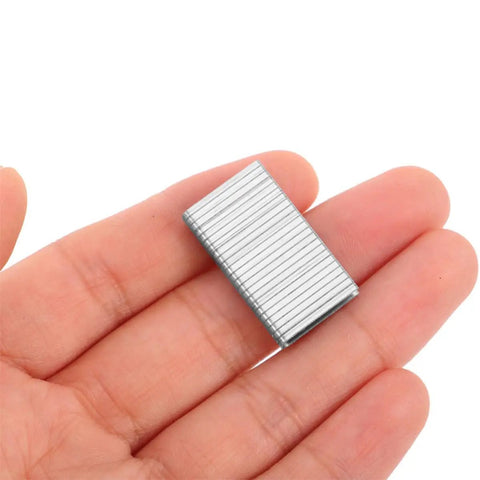 60 Piece Top Shelf Shutter Tilt Rod Repair Staples And Heavy Duty Metal Hardware Kit For Louver Hinge Restoration shown in hand.