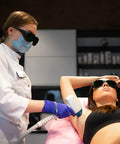 Top Shelf Laser Safety Eyewear Engineered For Red Light Therapy Clinics And At Home Hair Removal Gear With Heavy Duty 200 To 2000Nm Uv Blocking And Infrared Shielding Dark Green Lenses worn during laser hair removal treatment.