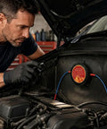 Top Tier Automatic Aerosol Fire Extinguisher Sticker With Super Easy Peel And Stick Mounting For Car Engine Bays EV Battery Cabinets And Electrical Panels Serving Hella Reliable Five Second Flame Shutdown And Totally Maintenance Free Shield That Quickly installed in a car engine bay with a technician inspecting it.