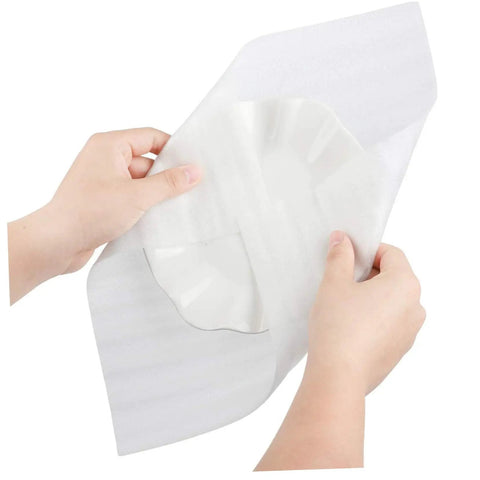 Hands holding a 100 Pack White EPE Foam Pouch, showing its protective feature for delicate items during shipping.