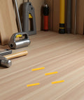 Four yellow wall plugs from 200 Pack Yellow Self Drilling Ribbed Wall Plugs Set for Drywall and Hollow Walls on a wooden surface