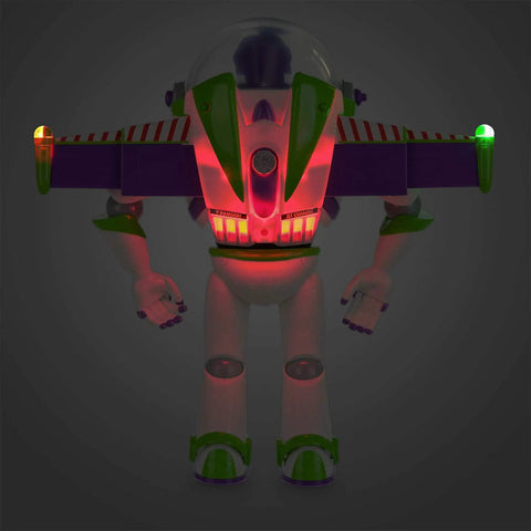 Totally Tubular Buzz Lightyear Interactive Talking Action Figure Featuring Eleven Authentic Voice Lines And Rad Wing Deployment With Pulsing Laser Beam, with animated wings and glowing lights.