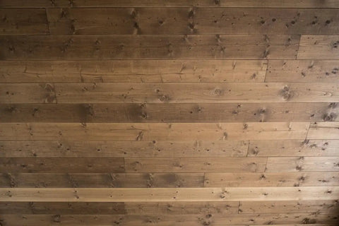 Top Shelf Saddlewood Reactive Interior Wood Stain Water Based VOC Free Blend Brings A Heavy Duty Warm Leather Vibe To Rustic Ranch And Craftsman Spaces Pro Grade Smooth Roll Out Massive 55 Gallon Drum Finish on richly stained wooden ceiling planks.