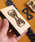 Dope Bow Shape Leather Cutting Die Set Two Pack For DIY Leather Projects shown in hand with wooden frame and Japanese steel blades.