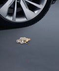 Quick Dump Valve for Tire Changer Machines with Bead Breaker Cylinder, heavy-duty metal valve shown beside tire wheel