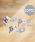 Thirty Pack Three Quarter Inch EMT Conduit Straps Zinc Plated Steel Single Hole Clamps For Electrical Metallic Tubing on wooden background