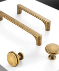 Top Shelf 5 Inch Antique Brass Cabinet Pulls For Kitchen Drawers 10 Pack Rock Solid Steel Rust Free Finish Sweet Retro Look showing two handles and two knobs.