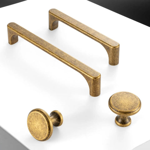 Top Shelf 5 Inch Antique Brass Cabinet Pulls For Kitchen Drawers 10 Pack Rock Solid Steel Rust Free Finish Sweet Retro Look showing two handles and two knobs.