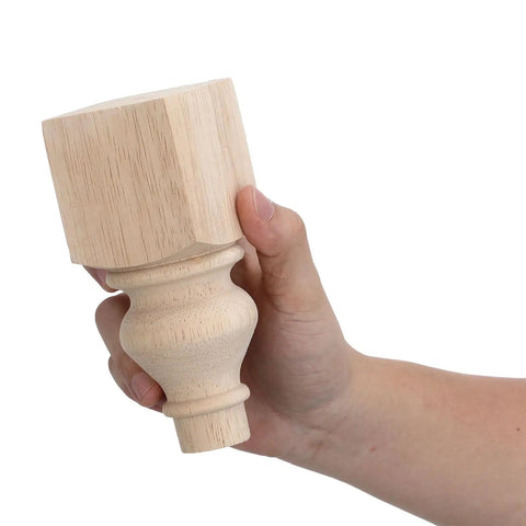 Hand holding Two Pack Round 5.9 Inch Solid Wood Sofa Legs With Unfinished Surface And Carved Design, heavy duty furniture feet