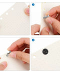 Top Shelf Stainless Steel Chicago Binding Screws 30 Piece Set 5Mm X 25Mm Phillips Head stud posts being inserted into paper.