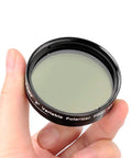 Hand holding 2 Inch Variable Polarizing Moon Filter For Telescopes With Multi Coated Optical Glass Aluminum Frame Pro Grade