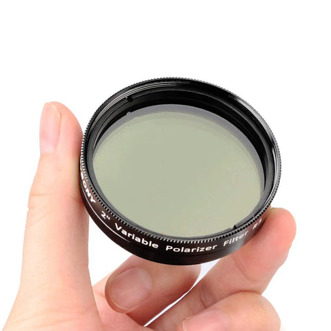 Hand holding 2 Inch Variable Polarizing Moon Filter For Telescopes With Multi Coated Optical Glass Aluminum Frame Pro Grade