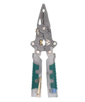 Hella Versatile Foldable Wire Stripper And Compact Hand Pliers With Built In Voltage Tester For Pro Electricians And Weekend Warriors. Silver metal pliers with green rubber grips.