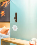 Straight Up Solid Natural Wood Wall Hooks For Bags And Hats Vintage Branch Coat Rack Entryway Storage holding a keychain.