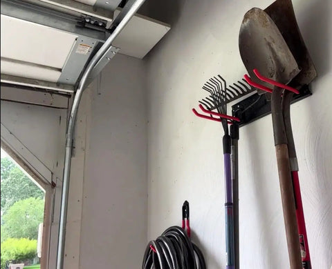 Heavy Duty Multi Storage Garage Hooks Wall Mounted Garden Tool Organizer Featuring Rock Solid Rails for a rake and shovel.