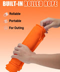 Person holding orange Rollable Silicone Grill Mat For Griddle Tools And BBQ Accessories with built-in rolled rope feature.