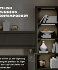 Four Pack Cold White LED Shelf Lights With Memory Function, illuminating a cabinet with decorative items on shelves.