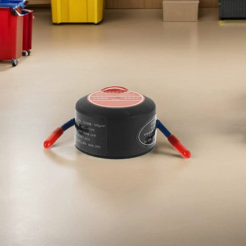 No Brainer Car Safety Upgrade Automatic Aerosol Fire Extinguisher With Rapid Heat Activation and Peel Stick Adhesive Mount for Engine Bays Garages and Office Spaces on a floor.