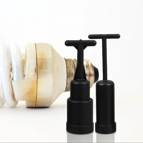 Close-up of Slick Eight Piece Light Socket Ring Remover Plastic Wrench Set G9 E14 E26 E27 Bulb Base Adapter tools next to a bulb.