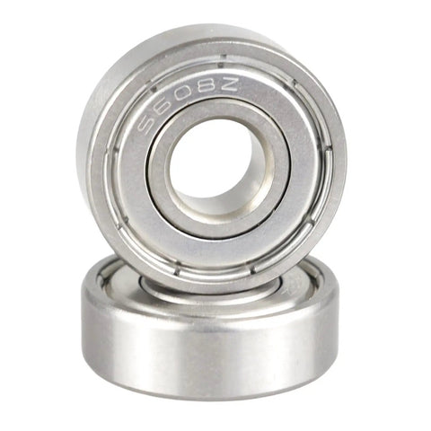 Close-up of two 10 Pack S608ZZ Stainless Steel Ball Bearings 8X22X7MM ABEC 5 with metal shields for motors.