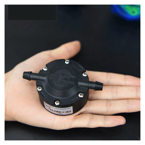 Heavy Duty Adjustable Automatic Dosing Pump With Flow Smoothing Tech held in hand, showcasing compact design for precision dosing in industrial use.