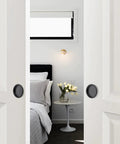 Bedroom scene with white closet doors using 4 Pack Closet Door Finger Pulls For 2-1/8 Inch Holes Stainless Steel Sliding Door Hardware With Easy Snap-In Installation No Nails Needed Durable Finger Pulls For Smooth Closet Door Operation And Quick DIY Replacement, featuring black round handles.