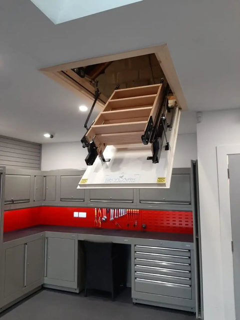 Premium Electric Attic Lift Stairs With No Sweat Remote Control Built Rugged Beech Wood Frame For Homes 7 Feet 10 Inches To 9 Feet 6 Inches Tall open in a modern kitchen.