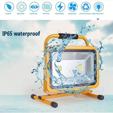 Heavy Duty 100W Rechargeable LED Floodlight With 270 Degree Swivel Bracket And Solid Aluminum Construction Waterproof Ip65 Rated, splashes of water over a yellow floodlight.