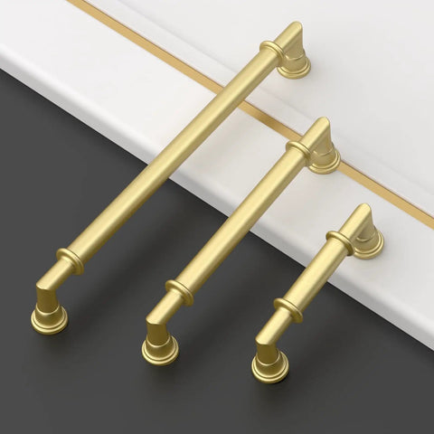 Top Notch Brushed Gold Cabinet Handles And Drawer Pulls For Kitchen Cupboards Rust Proof Metal Hardware Absolutely No Sweat Setup Heavy Duty Build Quality 10 Pack - three sizes displayed on a surface.