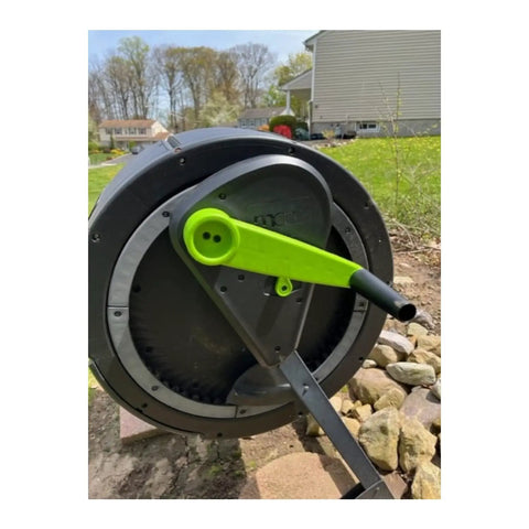 Two Stage 65 Gallon Compost Tumbler With Easy Turn Gear Kit And Cart For Effortless Turning And Rich Garden Compost, Perfect Starter Kit For Busy Home Gardeners, with a focus on the green gear handle visible.