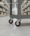 Badass Swivel Plate Caster With Two Point Five Inch TPR Wheel And 4X4 Mounting Base for sturdy cart mobility in a warehouse setting.