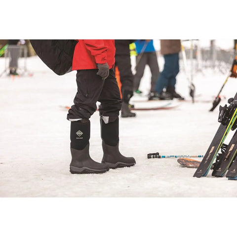 Mens Arctic Sport Tall Winter Boots In Black Featuring Heavy Duty Built Tough Outsole And Dang Snug Fleece Interior worn on snow.