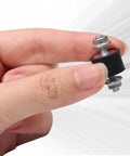 Top Shelf Rubber Vibration Isolator Mounts Eight Piece Kit Featuring M4 X 10mm Threads and 15 X 10mm Base in hand for heavy-duty applications.