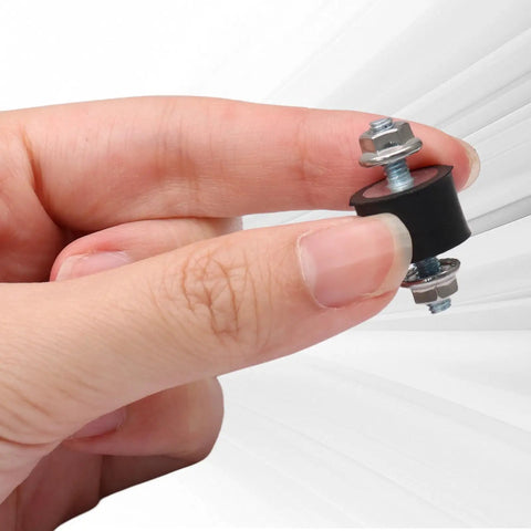 Top Shelf Rubber Vibration Isolator Mounts Eight Piece Kit Featuring M4 X 10mm Threads and 15 X 10mm Base in hand for heavy-duty applications.