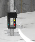 Digital caliper measuring 12.0 mm thickness of Smooth Operator Lazy Susan Serving Tray For Dining Tables.