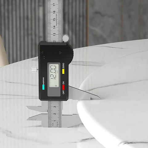 Digital caliper measuring the thickness of Fresh White Marble Lazy Susan Featuring Hella Smooth 360 Degree Rotation.