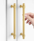 Swanky Gold Finish On Heavy Duty Solid Brass Cabinet Pulls Double Hole Mounting Fits Kitchen Drawers And Wardrobes 260 Millimeter Premium Furniture Hardware shown on a cabinet with a hand touching one pull.