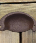 Solid As A Rock Brass Retro Drawer Pull Knockout Vintage Cast Iron Cabinet Knob top view showing rustic brown finish and mounting holes.