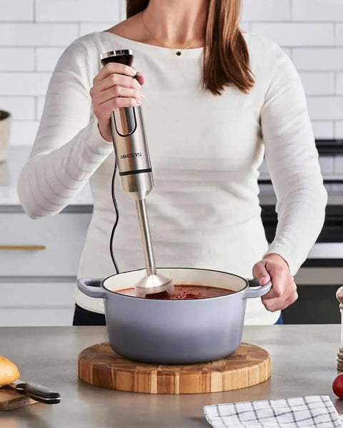 Powerful Handheld Immersion Blender 700W With Infinite Variable Speeds All In One Stainless Steel Stick Mixer in use for soup