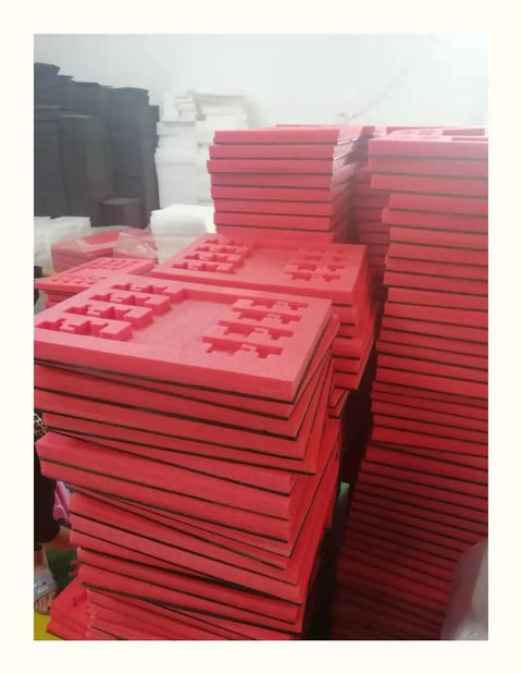 Premium Heavy Duty Red Foam Packing Sheets, 50X50 Cm, 5Mm Soft Cushioning for Toolboxes stacked in a warehouse.