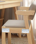 Twenty Pack Stainless Steel Flat Mending Brackets for Furniture Repair on chair leg, enhancing stability and support.