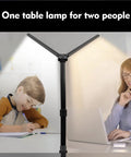 Double Head LED Desk Lamp With 24W Power, Big Reach Adjustable Arm, illuminating two people reading and studying