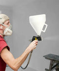 Pro Grade Air Texture Sprayer Featuring An Extended Swing Lever And Three Interchangeable Nozzles For Dead Smooth Wall Finishes in use.