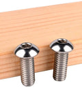 Solid 304 Stainless Steel Button Head Socket Cap Screws 10 24 X 5 8 Inch Allen Hex Drive installed on wood.