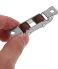 Four Piece Sliding Door Rollers With Double Wheel Bearing Track Pulleys For Smooth As Butter Glide, shown in hand, steel construction.