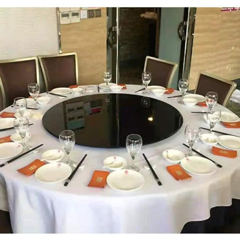 Smooth As Butter Lazy Susan Turntable For Dining Table on a set dining table with glasses and plates, ready for meals.