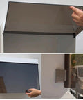 Universal EV Charger Cover With Wall Mount Hardshell Enclosure And Sloping Waterproof Canopy showing installation with hand holding top flap.