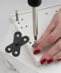 4 Pack Stainless Steel Hidden Door Hinges installation on white panel with screwdriver and hand visible