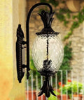 Badass Outdoor Wall Sconce Featuring Waterproof Glass Lantern Design For Courtyards And Spacious Patios, aluminum frame with glass shade.